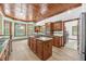 Spacious kitchen with a center island, wooden cabinets, and an inviting, retro feel at 1626 Wood Duck Dr, Winter Springs, FL 32708