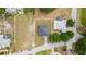 Aerial view of a property showcasing its spacious lot, landscaping, and neighborhood setting at 1755 Waterview Dr, Leesburg, FL 34748