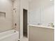 Bathroom showcasing a soaking tub, tiled shower, and a closet for storage at 1755 Waterview Dr, Leesburg, FL 34748