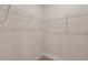 Spacious walk-in closet featuring adjustable wire shelving providing versatile storage solutions at 1755 Waterview Dr, Leesburg, FL 34748