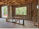Interior under construction with exposed framework, concrete floors, and electrical wiring at 1910 Glencoe Rd, Winter Park, FL 32789