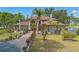 Stunning two-story home featuring meticulous landscaping and a circular driveway at 2910 Frontier Dr, Kissimmee, FL 34744