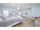 Spacious bedroom with neutral tones, a vaulted ceiling, and a cozy sitting area at 4469 Old Bear Run, Winter Park, FL 32792