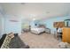 Spacious bedroom with blue walls, a cozy couch, and a functional workspace at 4469 Old Bear Run, Winter Park, FL 32792
