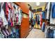 Spacious walk-in closet with custom shelving and hanging rods for optimal organization at 4469 Old Bear Run, Winter Park, FL 32792