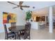 Dining room with wood table, seating for four, view to a gourmet kitchen and tile flooring throughout at 4469 Old Bear Run, Winter Park, FL 32792
