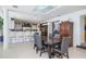 Dining area featuring a rustic wood table, seating for eight and a view to a gourmet kitchen at 4469 Old Bear Run, Winter Park, FL 32792