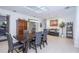 Spacious dining room with a large table, stylish chairs, and ample natural light from a skylight at 4469 Old Bear Run, Winter Park, FL 32792