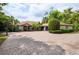 Charming ranch home with a meticulously maintained yard and circular driveway, ideal for Gathering living and entertaining at 4469 Old Bear Run, Winter Park, FL 32792