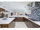 Spacious kitchen with a large island, modern appliances, and ample counter space for cooking and entertaining at 4469 Old Bear Run, Winter Park, FL 32792