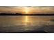 Picturesque view of a stunning sunset over the calm waters of the lake at 4469 Old Bear Run, Winter Park, FL 32792