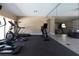 Community gym showcasing exercise equipment, including an elliptical, treadmill and stationary bike at 4874 Matteo Trl, Orlando, FL 32839
