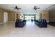 Community lounge area with leather sofas, tile flooring, and access to a gym and a meeting room at 4874 Matteo Trl, Orlando, FL 32839