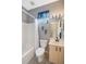 Standard bathroom with a tub shower combination, window, and a modern vanity at 5201 Lake Marion Golf Resort # 5201, Kissimmee, FL 34759