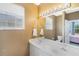 Bathroom with dual sinks and view into bedroom at 5201 Lake Marion Golf Resort # 5201, Kissimmee, FL 34759
