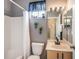 Standard bathroom with a tub shower combination, window, and a modern vanity at 5201 Lake Marion Golf Resort # 5201, Kissimmee, FL 34759