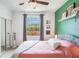 Bedroom with a closet and a large window overlooking the greenery at 5201 Lake Marion Golf Resort # 5201, Kissimmee, FL 34759