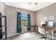 Well-lit bedroom with a neutral palette, a work desk, and a picturesque arched window at 5201 Lake Marion Golf Resort # 5201, Kissimmee, FL 34759