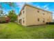 Building exterior showcasing an inviting backyard space and an open-air balcony at 5201 Lake Marion Golf Resort # 5201, Kissimmee, FL 34759