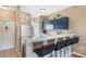 Well-lit kitchen area featuring a breakfast bar, stainless steel appliances, and ample counter space at 5201 Lake Marion Golf Resort # 5201, Kissimmee, FL 34759