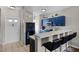 Well-lit kitchen featuring blue cabinets, breakfast bar with chairs, and modern appliances at 5201 Lake Marion Golf Resort # 5201, Kissimmee, FL 34759