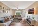 Inviting living room with a comfortable sectional, modern entertainment center, and bright natural lighting at 5201 Lake Marion Golf Resort # 5201, Kissimmee, FL 34759