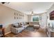 Comfortable living room featuring a large sectional sofa, ceiling fan, wood floors, and bright natural light at 5201 Lake Marion Golf Resort # 5201, Kissimmee, FL 34759