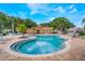 Community pool area showcases a refreshing amenity with lounge chairs and palm trees at 5201 Lake Marion Golf Resort # 5201, Kissimmee, FL 34759