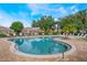 Community pool offers a refreshing atmosphere with ample seating and green landscaping at 5201 Lake Marion Golf Resort # 5201, Kissimmee, FL 34759