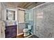 Stylish bathroom featuring a vessel sink, patterned shower, and modern fixtures at 1010 N Clayton St, Mount Dora, FL 32757