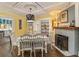 Charming dining room with a decorative light fixture and access to the kitchen at 1010 N Clayton St, Mount Dora, FL 32757