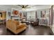 Spacious living room with wood floors, fireplace, and stylish decor, creating a comfortable and inviting atmosphere at 1010 N Clayton St, Mount Dora, FL 32757