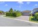 Charming single-Gathering home features a paved driveway, tile roof, and manicured landscaping at 10399 Macduff Dr, Orlando, FL 32832