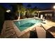 Enjoy this backyard pool with lush landscaping and custom lighting for evening enjoyment at 10399 Macduff Dr, Orlando, FL 32832