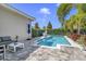 This backyard offers a beautiful pool, patio area, and well-maintained landscaping at 10399 Macduff Dr, Orlando, FL 32832