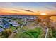 Panoramic aerial view of a picturesque community with stunning sunset and lush green spaces at 1224 Union Club Dr, Winter Garden, FL 34787