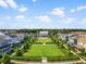Aerial view of a manicured park surrounded by beautiful homes in a lovely neighborhood at 1224 Union Club Dr, Winter Garden, FL 34787