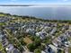 Expansive aerial shot of a waterfront community, highlighting the serene lake and well-maintained homes at 1224 Union Club Dr, Winter Garden, FL 34787