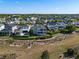 Scenic aerial view of an idyllic neighborhood showcasing manicured lawns and tree-lined streets at 1224 Union Club Dr, Winter Garden, FL 34787