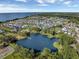 Breathtaking aerial view of community with lake, showcasing the neighborhood's layout and proximity to the ocean at 1224 Union Club Dr, Winter Garden, FL 34787