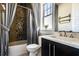 Stylish bathroom featuring a modern vanity, decorative shower curtain and a bright window at 1224 Union Club Dr, Winter Garden, FL 34787