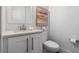 Neat bathroom with a white vanity, modern fixtures, and an elegant framed painting at 1224 Union Club Dr, Winter Garden, FL 34787