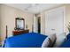 Bright bedroom with a four poster bed, wood flooring, and large windows with a walk in closet at 1224 Union Club Dr, Winter Garden, FL 34787
