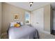 Cozy bedroom with a large window, ceiling fan, neutral carpet, and natural light at 1224 Union Club Dr, Winter Garden, FL 34787