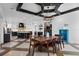 Open-concept kitchen and dining area boasts coffered ceiling, chef's island and designer finishes at 1224 Union Club Dr, Winter Garden, FL 34787