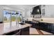 Chef's kitchen with large windows, granite counters, island, and top-of-the-line appliances at 1224 Union Club Dr, Winter Garden, FL 34787