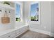 Welcoming mudroom with built-in bench seating, convenient storage, and natural light at 1224 Union Club Dr, Winter Garden, FL 34787