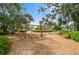 Charming neighborhood playground featuring swings and climbing structures set amongst mature trees and landscaping at 1224 Union Club Dr, Winter Garden, FL 34787