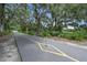 Picturesque walking path lined with mature trees draped with Spanish moss, near a lake at 1224 Union Club Dr, Winter Garden, FL 34787