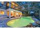 A captivating pool with a waterfall feature and covered lanai for outdoor relaxation at 12706 S Lake Sawyer Ln, Windermere, FL 34786